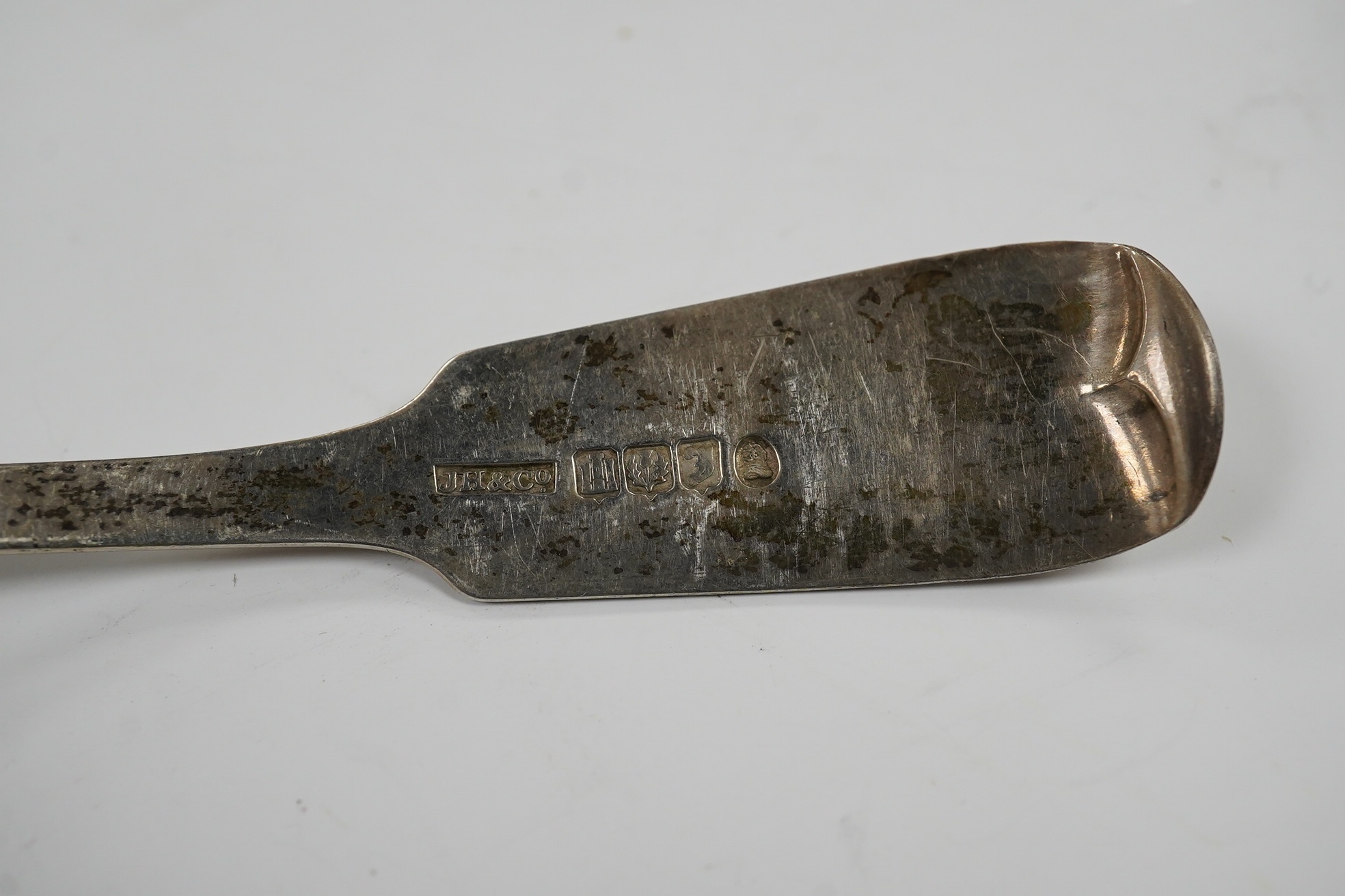 A set of three Victorian Scottish silver fiddle pattern sauce ladles, Edinburgh, 1840, one other silver sauce ladle and a pair of silver salts and two associated silver spoons. Condition - fair